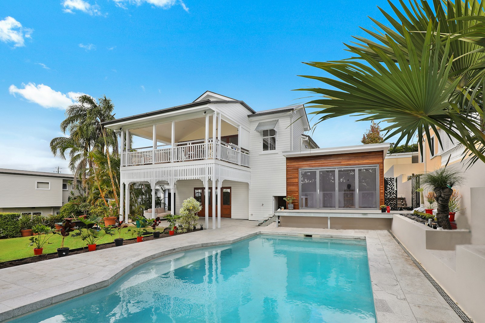 Modern farmhouse exterior with pool
